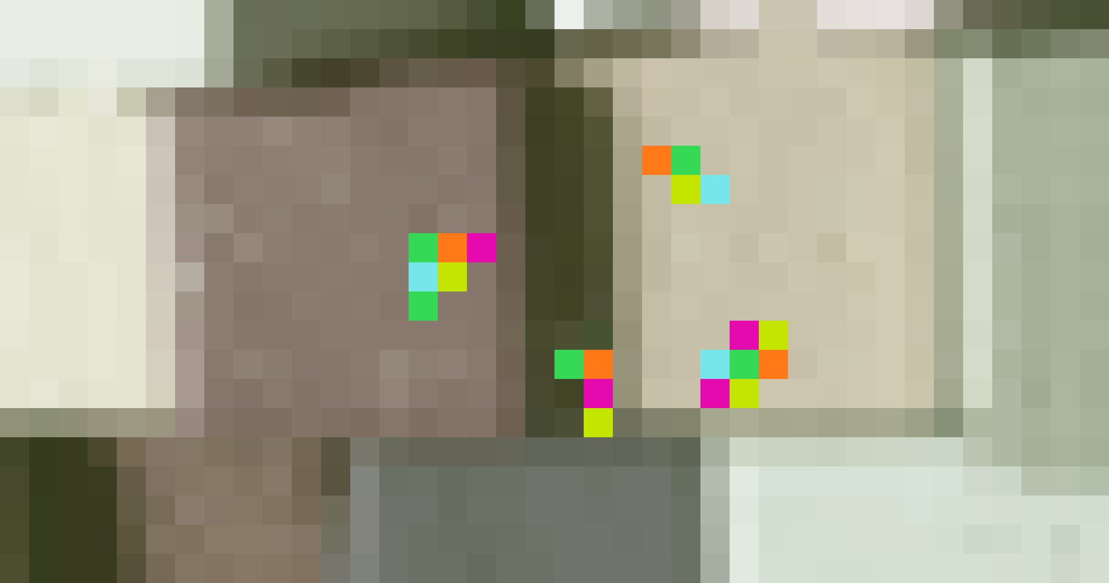 Pixelated, olive-toned photograph of stacked colored blocks, with colored Sia shards